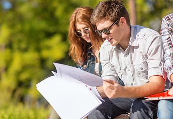 Image showing students with books, notebooks, files and folders