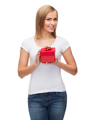 Image showing smiling girl with gift box