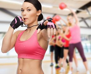 Image showing woman with whistle in gym