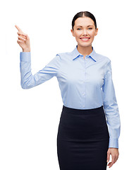 Image showing smiling woman with her finger up