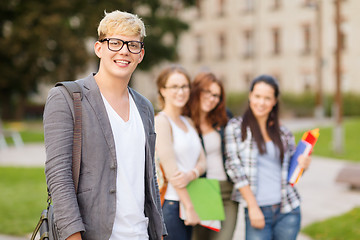 Image showing teenage boy with classmates on the back