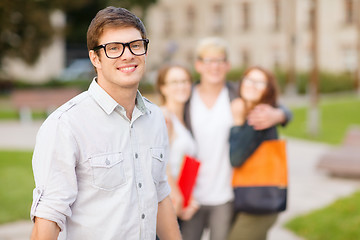 Image showing teenage boy with classmates on the back