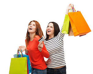 Image showing teenage girls with shopping bags and credit card