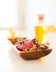 Image showing closeup of essential oil, flowers and pot-pourri