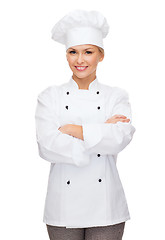 Image showing smiling female chef with crossed arms