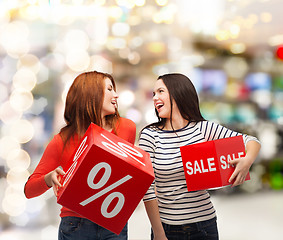 Image showing smiling teenage girl with percent and sale sign