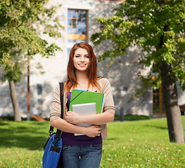 Image showing smiling student with bag, folders and tablet pc