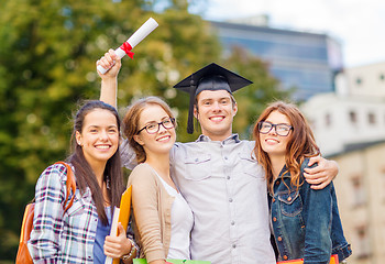 Image showing students or teenagers with files and diploma