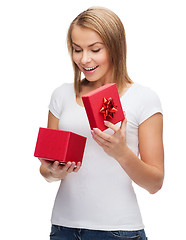 Image showing smiling girl with gift box