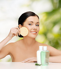 Image showing smiling woman with sponge