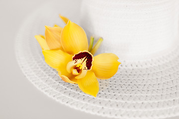 Image showing closeup of white hat and flowers