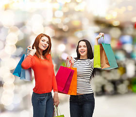 Image showing two smiling teenage girls with shopping bags