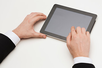 Image showing close up of man hands touching tablet pc