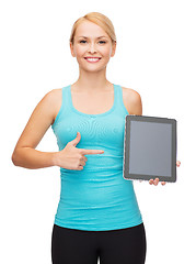 Image showing sporty woman with tablet pc blank screen