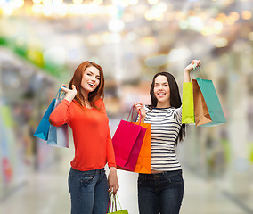 Image showing two smiling teenage girls with shopping bags