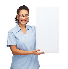 Image showing female doctor or nurse with white blank board