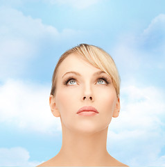 Image showing beautiful woman looking up