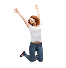 Image showing teenage girl in white blank t-shirt jumping