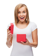 Image showing smiling girl with gift box