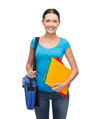 Image showing smiling student with bag and folders