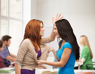 Image showing two teenagers having a fight and getting physical