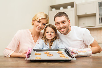 Image showing happy family making cookies at home