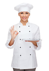 Image showing smiling female chef with tablet pc computer