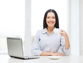 Image showing smiling businesswoman or student with laptop