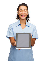 Image showing smiling female doctor or nurse with tablet pc