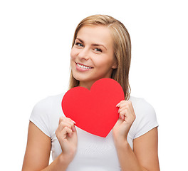 Image showing smiling woman in white t-shirt with heart