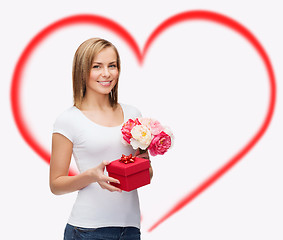 Image showing smiling woman with bouquet of flowers and gift box