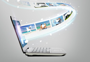 Image showing laptop computer with video on screen