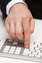 Image showing businessman working with keyboard