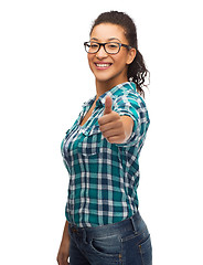 Image showing smiling girl in eyeglasses showing thumbs up