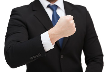 Image showing businessman showing something at his hand