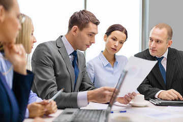 Image showing business team with laptop having discussion