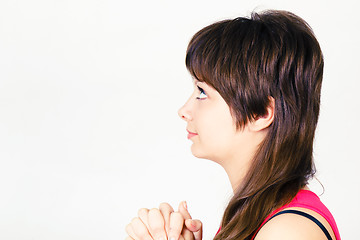 Image showing Young attractive girl praying
