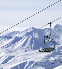 Image showing Chair lifts and off piste slope in fog