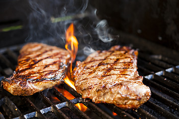 Image showing Steaks on barbecue