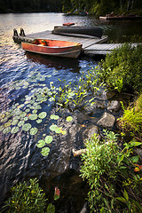 Image showing Rowboat at lake shore at dusk