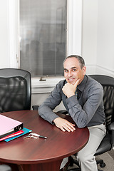 Image showing Businessman sitting in office meeting room