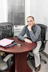 Image showing Businessman sitting in office meeting room