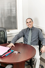 Image showing Businessman sitting in office meeting room