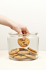 Image showing Stealing cookies from the cookie jar