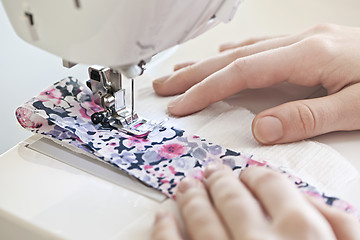 Image showing Hands with sewing machine