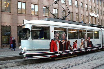 Image showing Moving HSL Tram with Tommy Hilfiger Advertisement