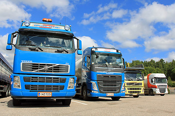 Image showing Four Trucks on a Yard