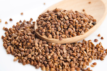 Image showing Buckwheat seeds on wooden spoon in closeup 