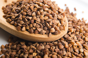 Image showing Buckwheat seeds on wooden spoon in closeup 