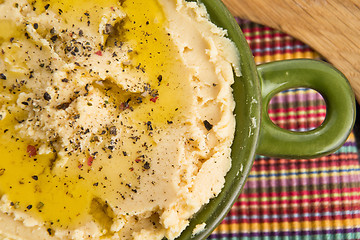 Image showing A bowl of creamy hummus